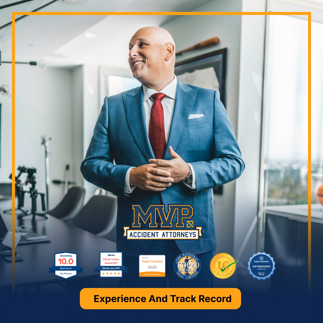 Professional attorney in blue suit and red tie in modern office, MVP Accident Attorneys branding with awards and certifications