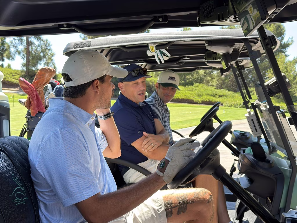 The group riding between holes during a Jake Adams and MVP partnership round.